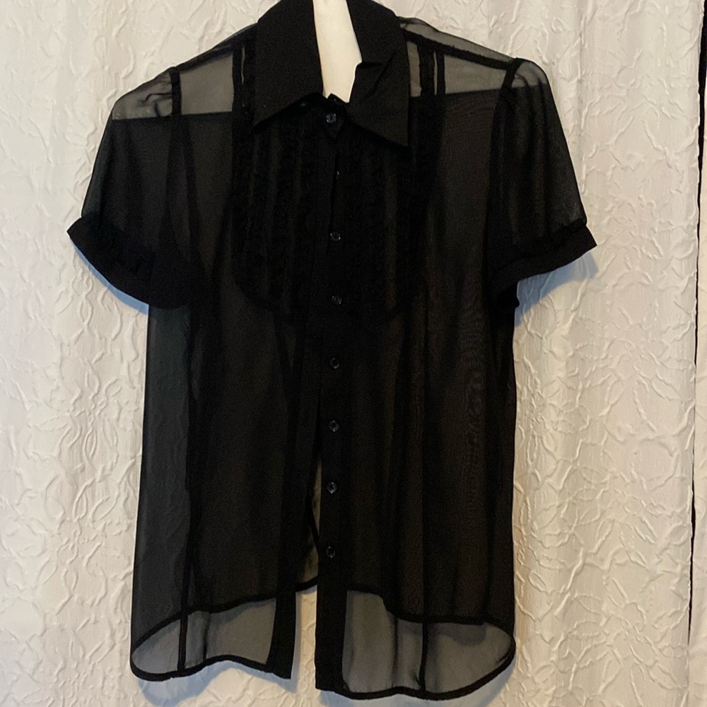 See through blouse made by Perception Concept.